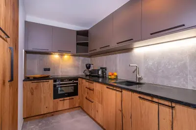 Cuisine ou kitchenette dans l'établissement La Cour aux Ecureuils