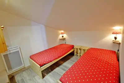 Un ou plusieurs lits dans un hébergement de l'établissement Le Hameau De Borsat - Situation privilègiée appartement proche piste MAE-1244