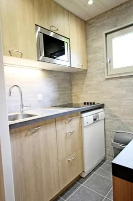 Cuisine ou kitchenette dans l'établissement Le Borsat - Idéalement situe dans la station MAE-1304