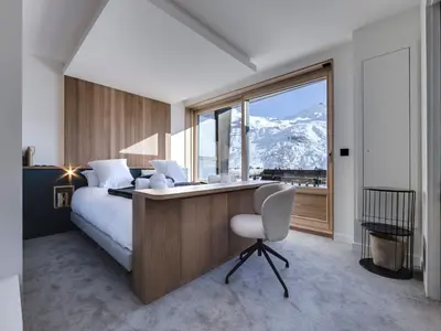 Un ou plusieurs lits dans un hébergement de l'établissement Appartement spacieux rénové avec terrasse et parking à Tignes - FR-1-641-11