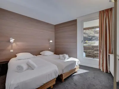 Un ou plusieurs lits dans un hébergement de l'établissement Appartement ski familial au cœur de Val Claret avec Wifi - FR-1-641-12