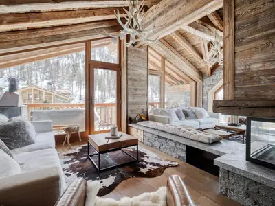 Coin salon dans l'établissement Chalet de luxe avec piscine, sauna, hammam, cinéma et salle de jeu - FR-1-694-3