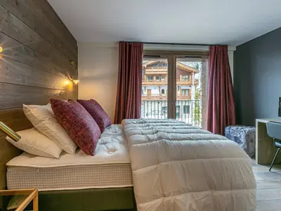 Un ou plusieurs lits dans un hébergement de l'établissement Appartement haut standing, 5 pièces pour 8 pers., proche du centre, lumineux, Val-d'Isère - FR-1-694-4
