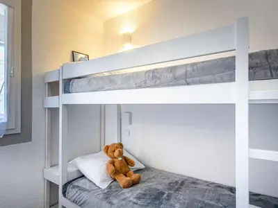 Un ou plusieurs lits dans un hébergement de l'établissement Appartement lumineux 6 pers, 2 sdb, wifi, garage, proche pistes et centre, casier à skis, animaux ok - FR-1-694-19