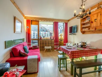 Coin salon dans l'établissement Coquet appartement montagnard proche commodités - FR-1-694-35
