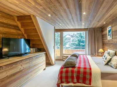 Télévision ou salle de divertissement dans l'établissement Spacieux duplex 3P avec wifi et balcon sud, parking inclus, près des pistes à Val-d'Isère - FR-1-694-27