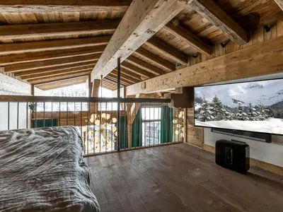 Un ou plusieurs lits dans un hébergement de l'établissement Duplex 5 pièces luxe aux pieds des pistes avec hammam et cheminée - FR-1-694-87