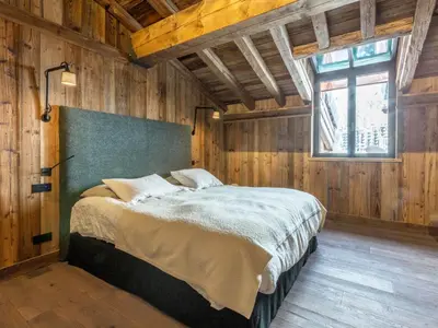 Un ou plusieurs lits dans un hébergement de l'établissement Duplex 5 pièces luxe aux pieds des pistes avec hammam et cheminée - FR-1-694-87