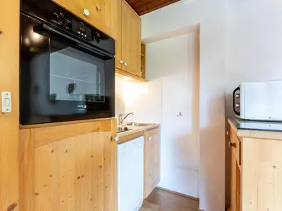 Cuisine ou kitchenette dans l'établissement Studio chaleureux au cœur de Val-d'Isère, animaux acceptés - FR-1-694-110