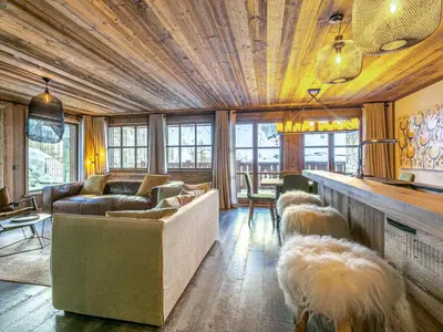 Coin salon dans l'établissement Luxueux appartement avec piscine, WiFi et parking à Val-d'Isère - FR-1-694-102