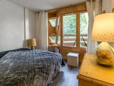 Un ou plusieurs lits dans un hébergement de l'établissement Charmant appartement aux pieds des pistes - 3 pièces pour 6 personnes - FR-1-694-111