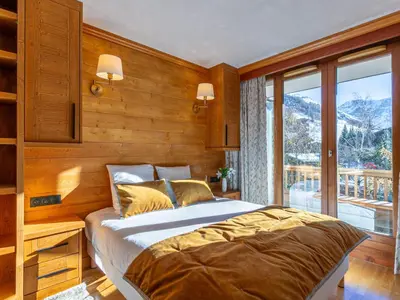 Un ou plusieurs lits dans un hébergement de l'établissement Charmant appartement 2 pièces avec WIFI au cœur de Val-d'Isère - FR-1-694-128
