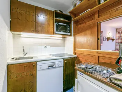 Cuisine ou kitchenette dans l'établissement Duplex 4 pièces avec WiFi, parking et animaux acceptés - FR-1-694-139