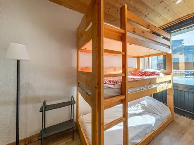 Un ou plusieurs lits dans un hébergement de l'établissement Appartement cosy au pied des pistes, animaux acceptés - FR-1-694-144