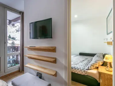 Un ou plusieurs lits dans un hébergement de l'établissement Charmant appartement au pied des pistes avec wifi - FR-1-694-157