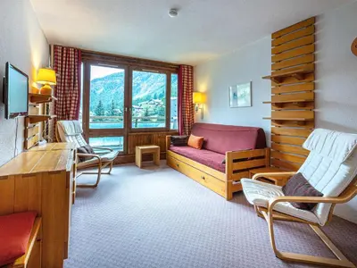 Coin salon dans l'établissement Appartement confortable skis aux pieds avec animaux admis à Val-d'Isère - FR-1-694-177