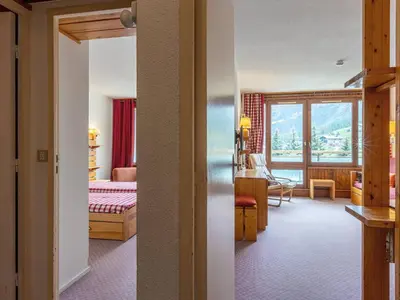 Un ou plusieurs lits dans un hébergement de l'établissement Appartement confortable skis aux pieds avec animaux admis à Val-d'Isère - FR-1-694-177