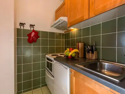 Cuisine ou kitchenette dans l'établissement Appartement confortable 5 pers, vue village - FR-1-694-195