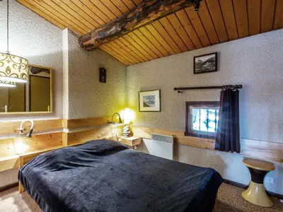 Un ou plusieurs lits dans un hébergement de l'établissement Charmant duplex montagnard avec grande terrasse, proche du vieux village de Val-d'Isère - FR-1-694-198