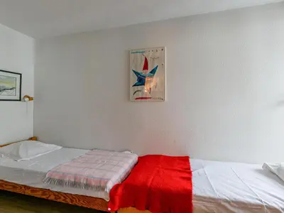 Un ou plusieurs lits dans un hébergement de l'établissement Appartement skis aux pieds, wifi, animaux admis, 4 pers - La Daille - FR-1-694-192