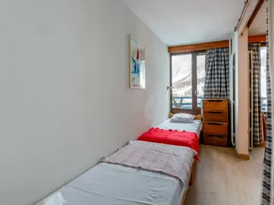 Un ou plusieurs lits dans un hébergement de l'établissement Appartement skis aux pieds, wifi, animaux admis, 4 pers - La Daille - FR-1-694-192