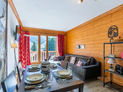 Coin salon dans l'établissement Charmant 3 pièces avec balcon, vue, et WiFi à Val-d'Isère - FR-1-694-201