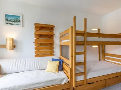 Un ou plusieurs lits dans un hébergement de l'établissement Appart cosy skis aux pieds avec parking et wifi, animaux admis à La Daille - FR-1-694-245