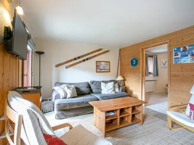 Coin salon dans l'établissement Élégant 4 pièces avec wifi à 5 min du centre de Val-d'Isère - FR-1-694-235