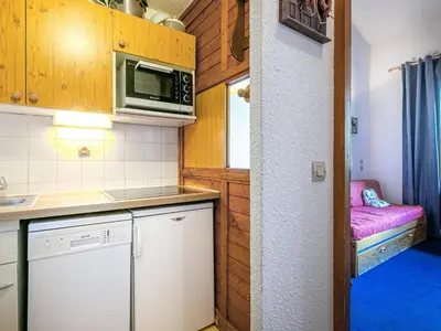 Cuisine ou kitchenette dans l'établissement Appartement 2 pièces + mezzanine avec balcon, parking et WiFi - FR-1-694-249
