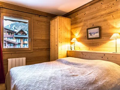 Un ou plusieurs lits dans un hébergement de l'établissement Appartement de standing, 3 chambres, balcon sud, centre de Val-d'Isère, proche pistes et commerces - FR-1-694-307