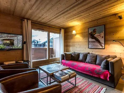 Coin salon dans l'établissement Appartement de standing, 3 chambres, balcon sud, centre de Val-d'Isère, proche pistes et commerces - FR-1-694-307