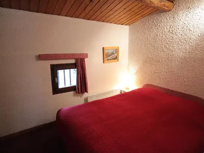 Un ou plusieurs lits dans un hébergement de l'établissement Duplex rustique avec grande terrasse au Sud, proche vieux Val-d'Isère - FR-1-694-310