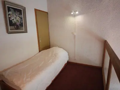 Un ou plusieurs lits dans un hébergement de l'établissement Duplex rustique avec grande terrasse au Sud, proche vieux Val-d'Isère - FR-1-694-310