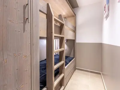 Un ou plusieurs lits dans un hébergement de l'établissement Studio cabine rénové au pied des pistes avec wifi et animaux acceptés - FR-1-694-299