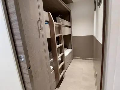 Un ou plusieurs lits dans un hébergement de l'établissement Studio cabine rénové au pied des pistes avec wifi et animaux acceptés - FR-1-694-299