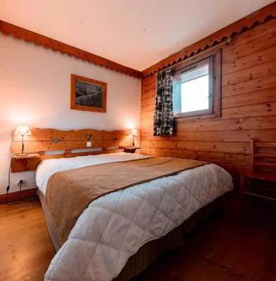 Un ou plusieurs lits dans un hébergement de l'établissement Résidence Roselend - Charmant appartement de 3 pièces situé dans une résidence au village du Chantel, proche des pistes et avec piscine. MAE-2474