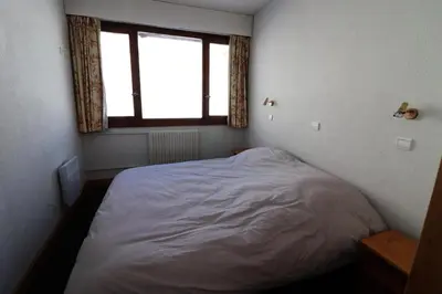 Un ou plusieurs lits dans un hébergement de l'établissement Résidence Bec Rouge - Appartement lumineux·Pieds des pistes·WIFI·Balcon MAE-2694