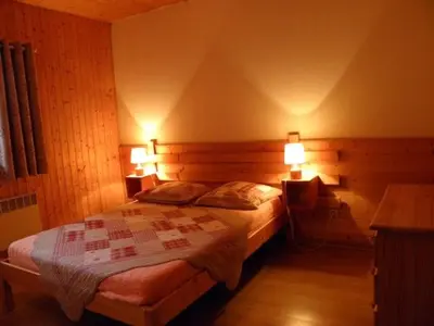 Un ou plusieurs lits dans un hébergement de l'établissement Chalet Les Eterlous