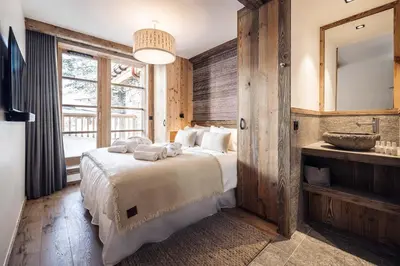Un ou plusieurs lits dans un hébergement de l'établissement Madame Vacances Chalet Atacama
