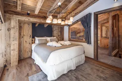 Un ou plusieurs lits dans un hébergement de l'établissement Madame Vacances Chalet Atacama
