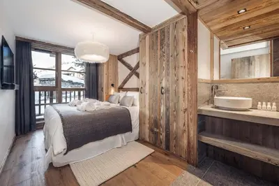 Un ou plusieurs lits dans un hébergement de l'établissement Madame Vacances Chalet Atacama