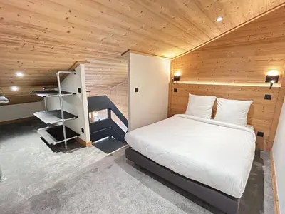 Un ou plusieurs lits dans un hébergement de l'établissement Résidence W 2050 - BELLE PLAGNE