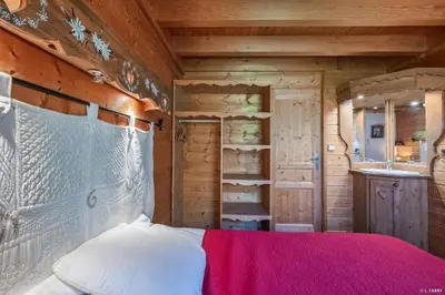 Un ou plusieurs lits dans un hébergement de l'établissement Chalet le Grand Bec