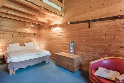 Un ou plusieurs lits dans un hébergement de l'établissement Chalet le Grand Bec