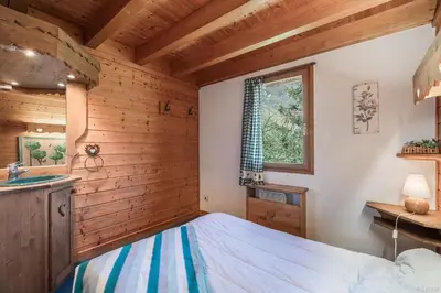 Un ou plusieurs lits dans un hébergement de l'établissement Chalet le Grand Bec