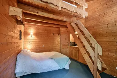 Un ou plusieurs lits dans un hébergement de l'établissement Chalet le Grand Bec