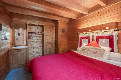 Un ou plusieurs lits dans un hébergement de l'établissement Chalet le Grand Bec