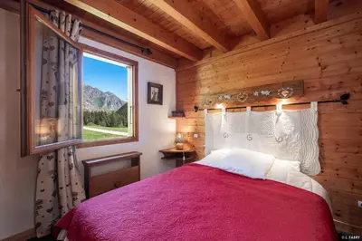 Un ou plusieurs lits dans un hébergement de l'établissement Chalet le Grand Bec