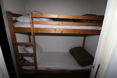 Un ou plusieurs lits superposés dans un hébergement de l'établissement Résidence Home Club - Studio lumineux·Proche pistes et commerces·Balcon MAE-3934