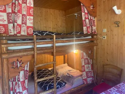 Un ou plusieurs lits dans un hébergement de l'établissement Le p'tit coin montagne